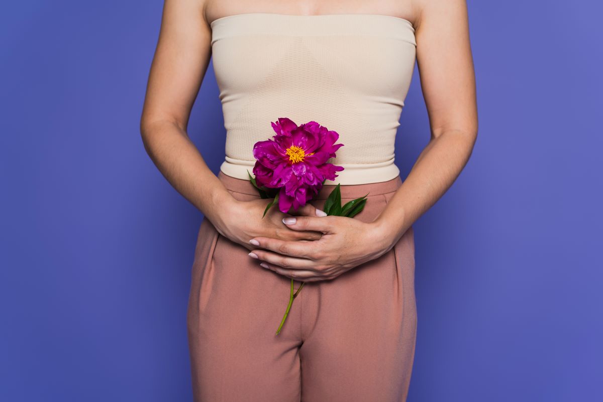slim female body holding flowers
